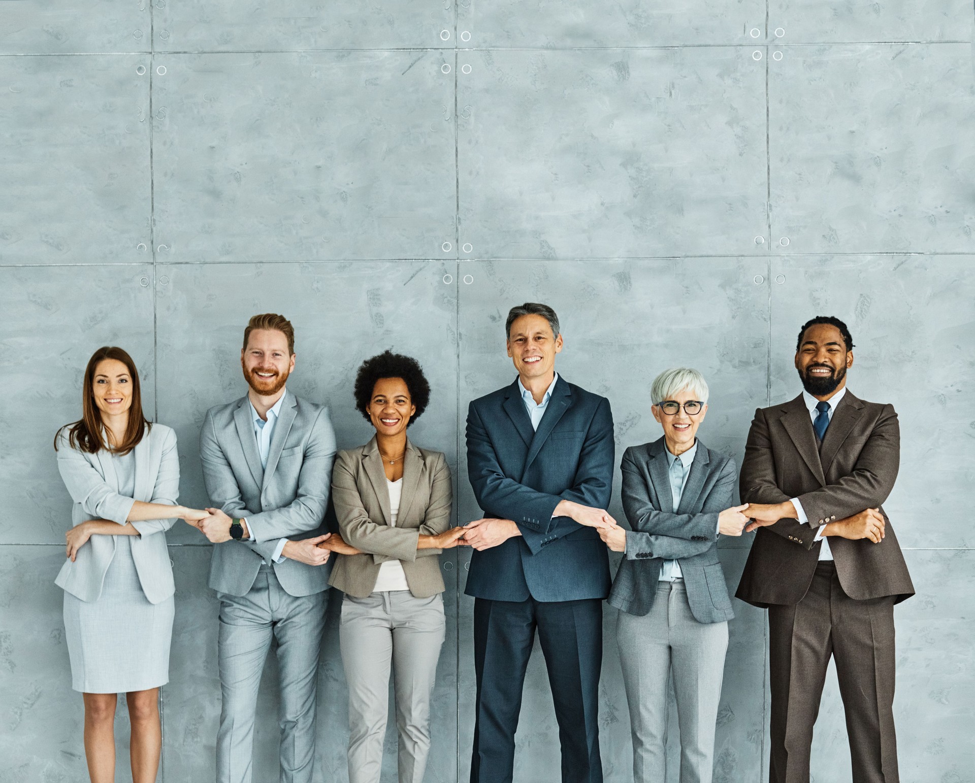 young business people meeting office portrait diversity teamwork group connection success holding hands unity senior mature colleague together