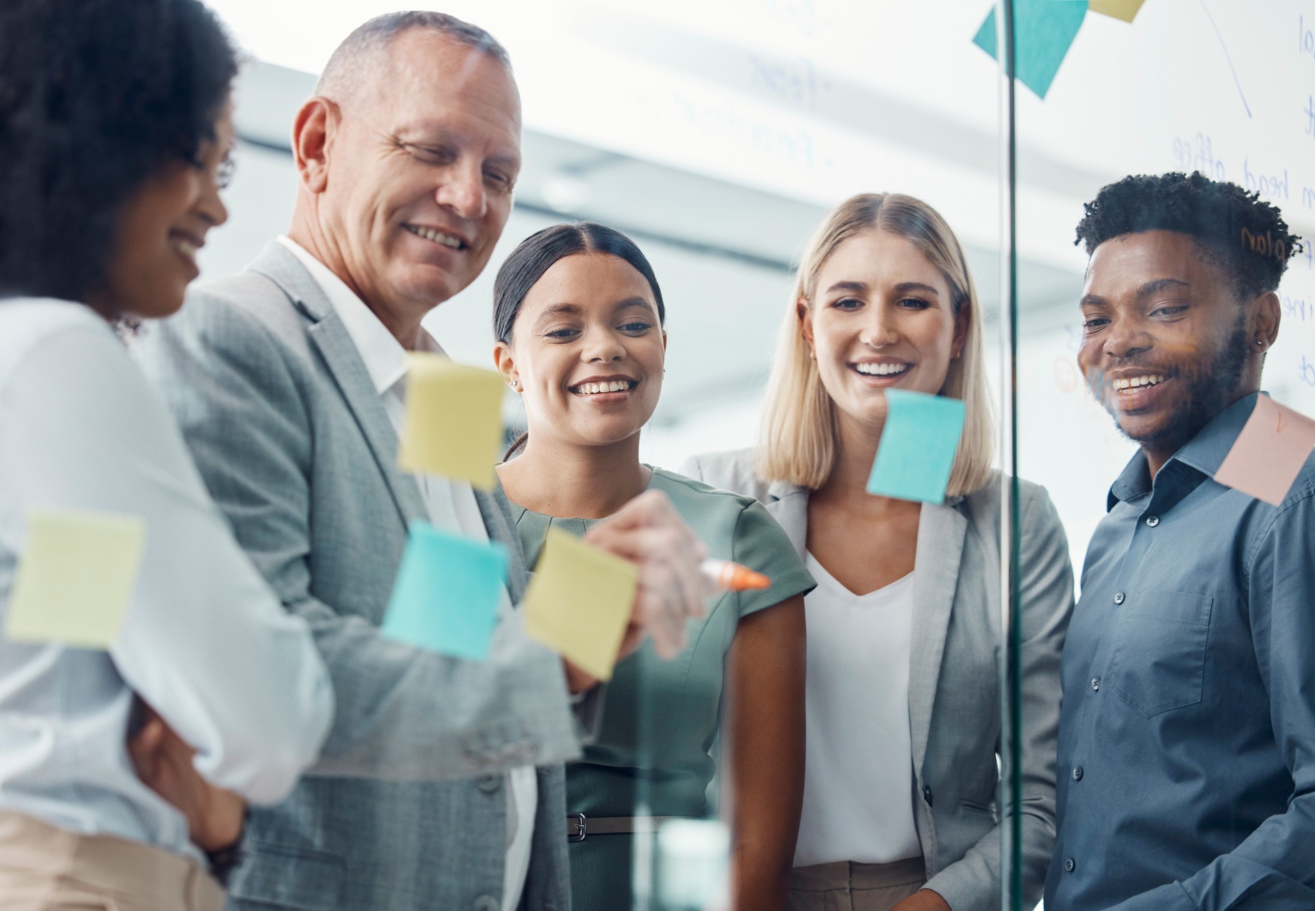 Teamwork, sticky notes or business team on a strategy, moodboard or storyboard in office. Corporate people, staff or workers working together on pinboard in collaboration, communication and planning